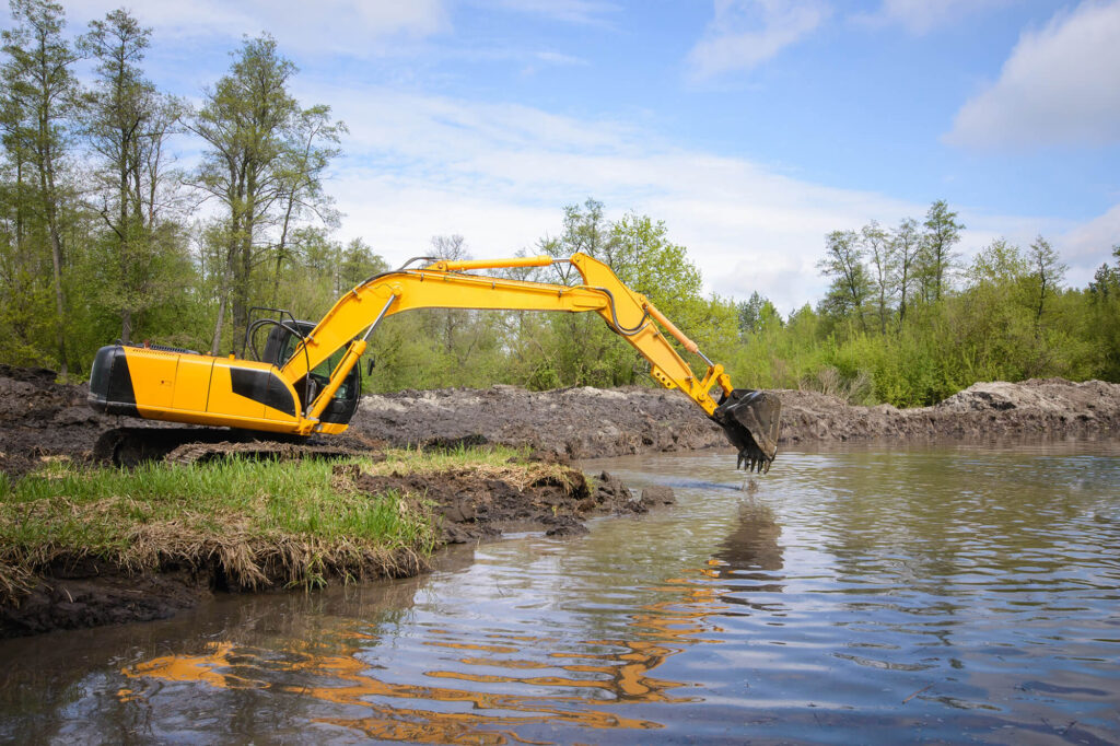 Pond building with excavator